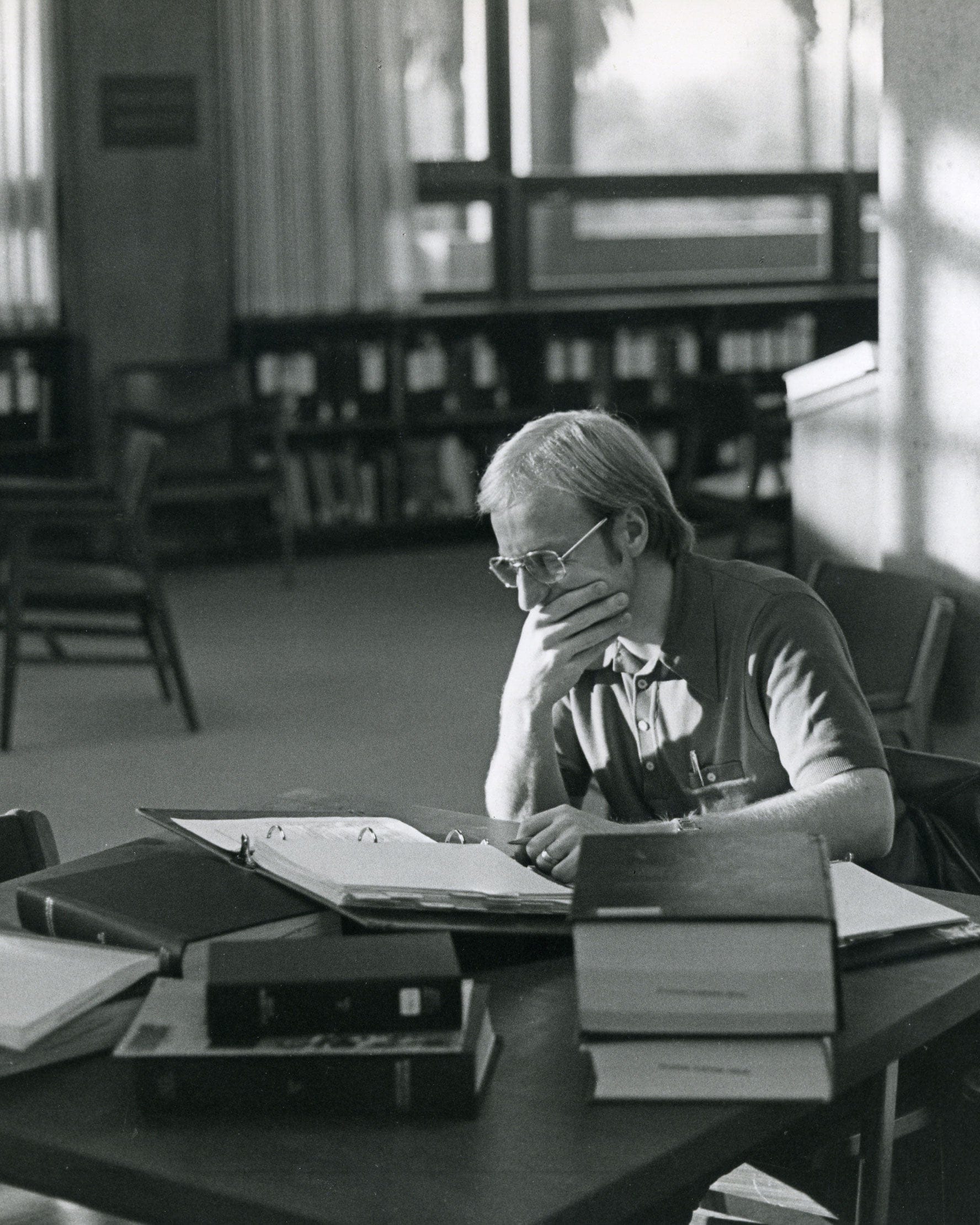 Person researching in library